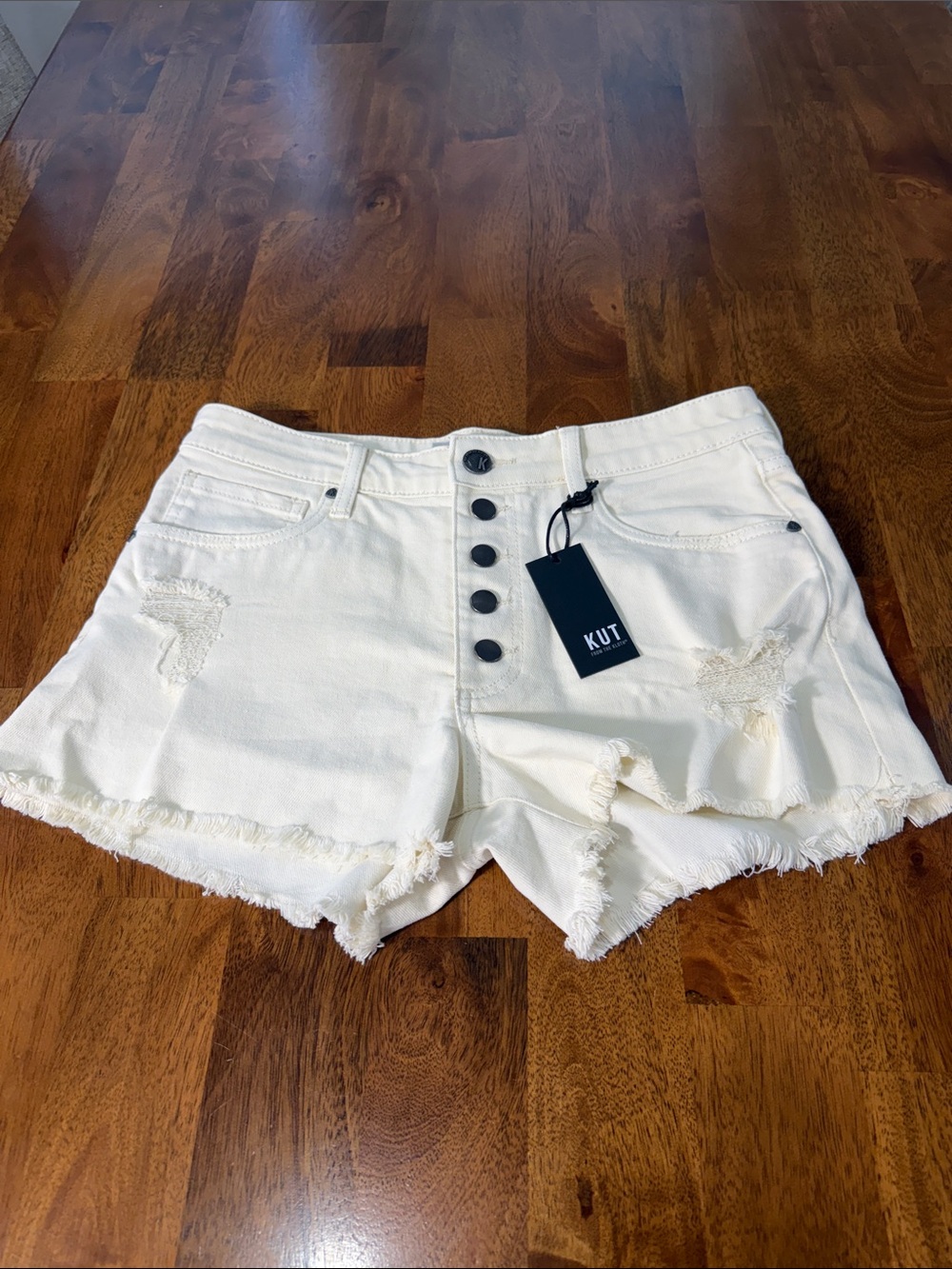 Kut from the Kloth White Distressed Button-Fly Denim Shorts cream/ivory color